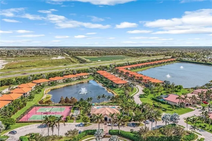 Drone / aerial view with a residential view and a water view