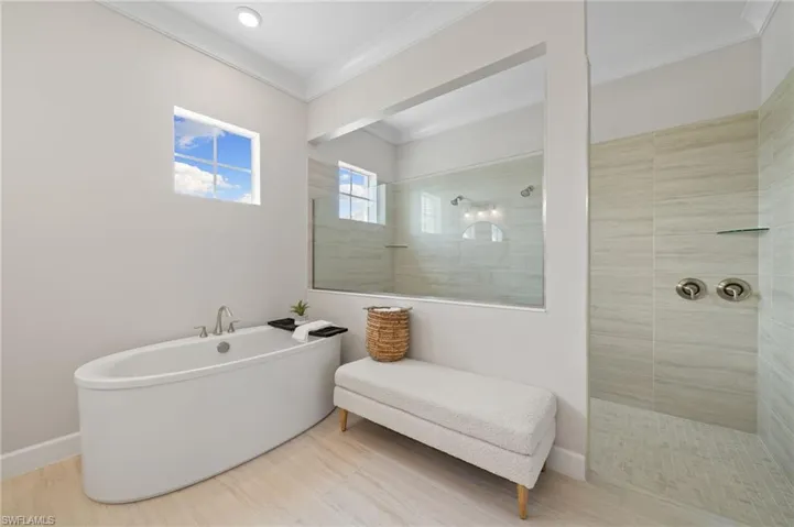 Bathroom with independent shower, bath and crown molding