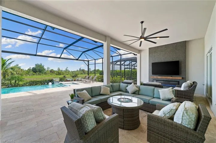 Sitting area with pool, TV, and lake views
