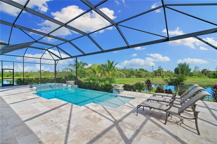 View of swimming pool featuring a lanai lounge area with water views