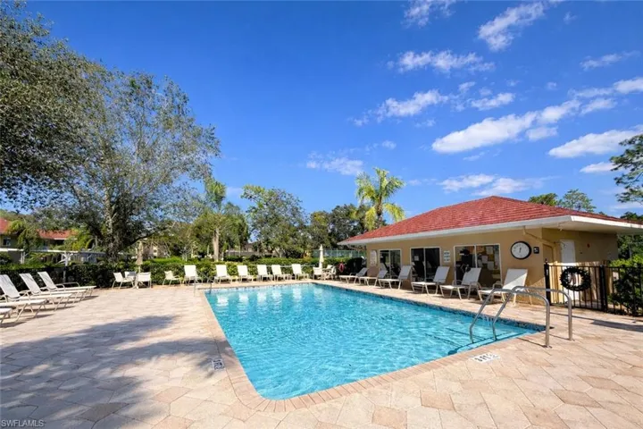 Community pool with a patio area