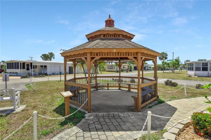 View of home's community featuring a gazebo and a yard