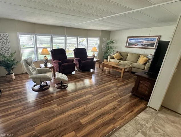 Living room with hardwood / wood-style floors
