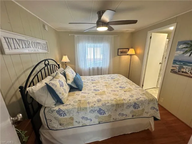 Bedroom featuring hardwood / wood-style flooring and ceiling fan