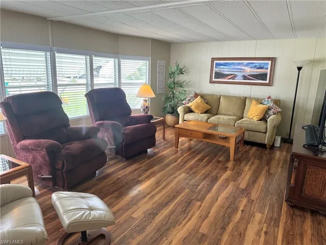 Living room featuring dark hardwood / wood-style flooring