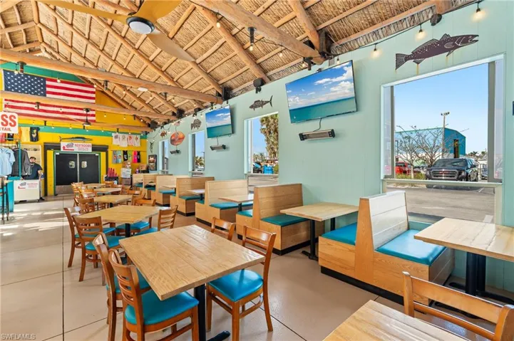 Dining area featuring vaulted ceiling