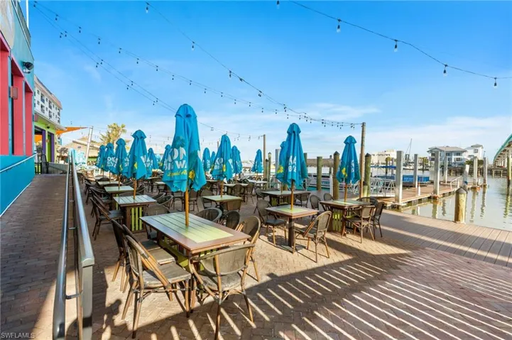 View of patio / terrace with a boat dock and a water view