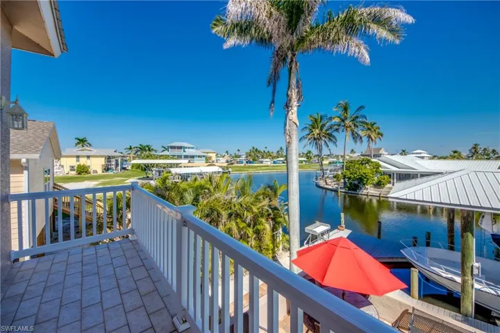 Balcony with a water view and a residential view