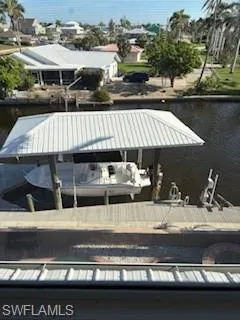 Dock featuring a water view and boat lift