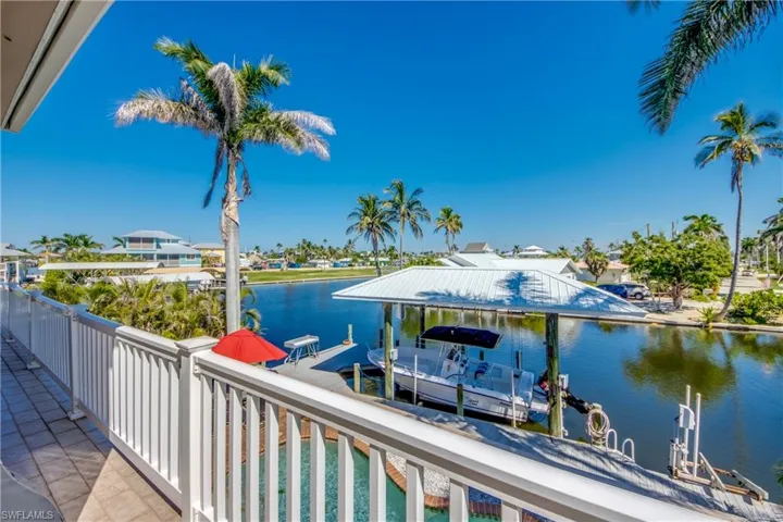 Dock area featuring a water view and boat lift