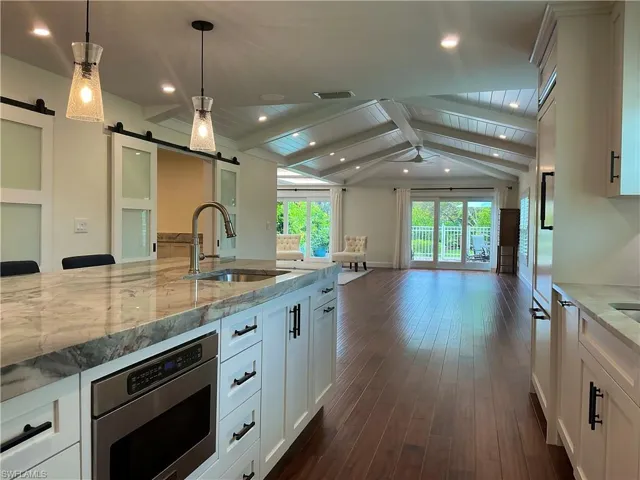 Kitchen with beautiful views of private pool and landscape