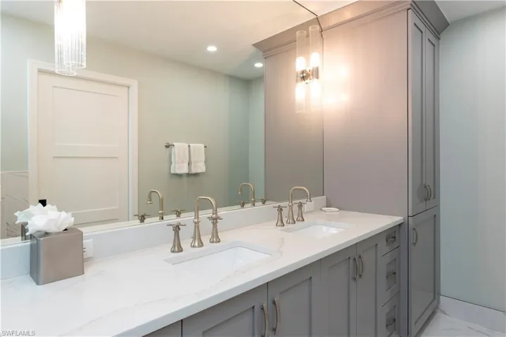 Master Bathroom with recessed lighting, marble finish floor and double vanity