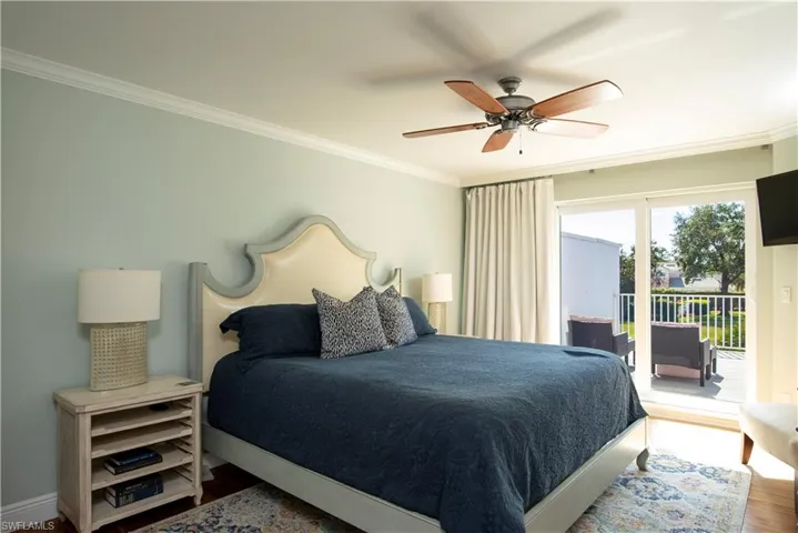 Master Bedroom featuring a spacious balcony with views of open green space