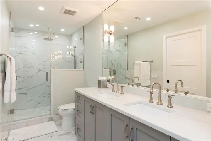 Master Bathroom featuring marble finish floor and shower