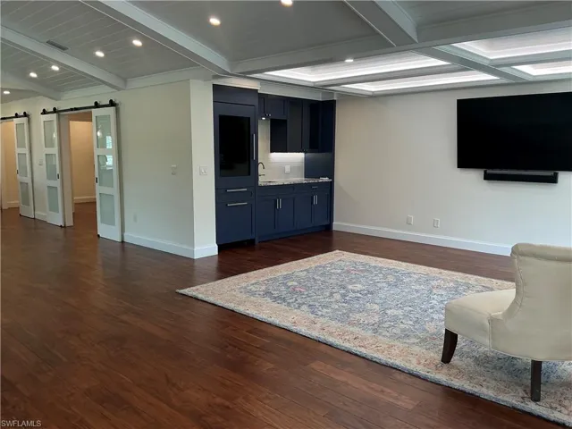 Living area with wine refrigerator, ice maker, beverage refrigerator and storage