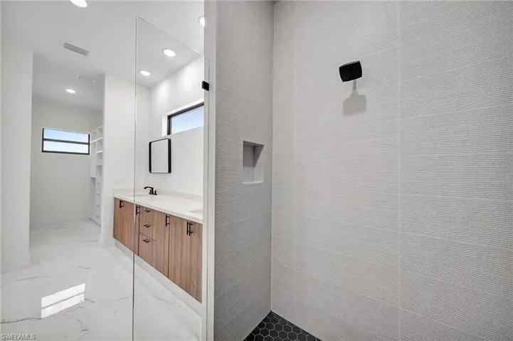 Bathroom featuring tile patterned floors and vanity