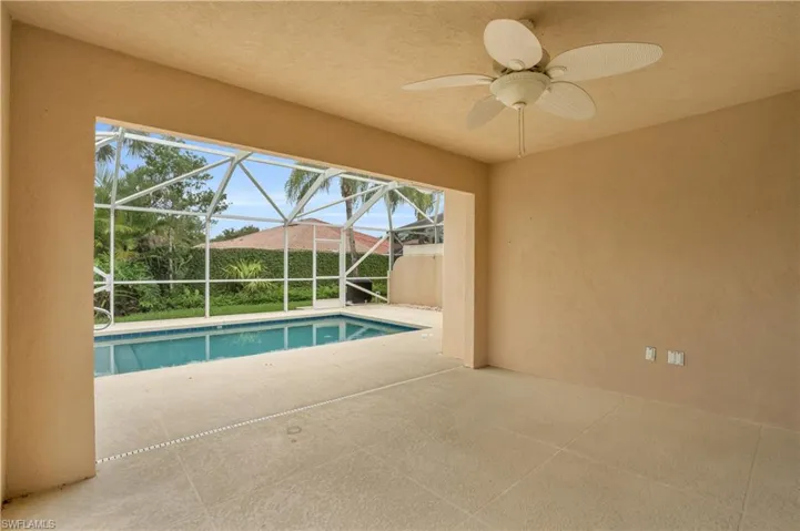 View of pool featuring ceiling fan