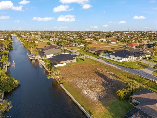 Aerial perspective of suburban area with a large body of water