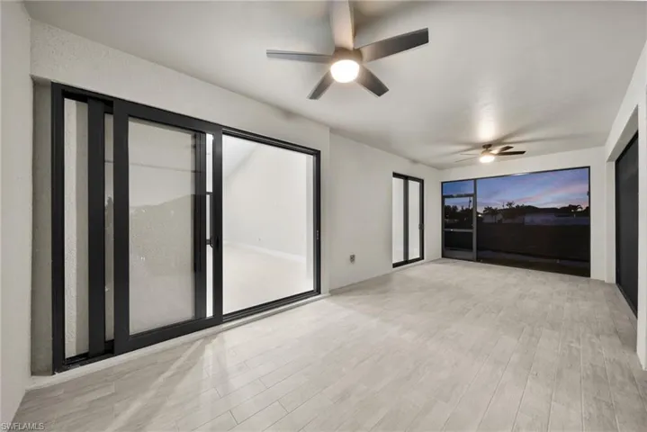 Spare room featuring light wood-style floors and ceiling fan
