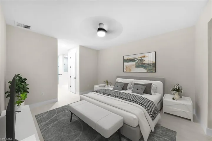 Bedroom with a ceiling fan and light wood-style flooring