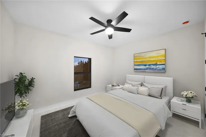 Bedroom with a ceiling fan and wood finished floors