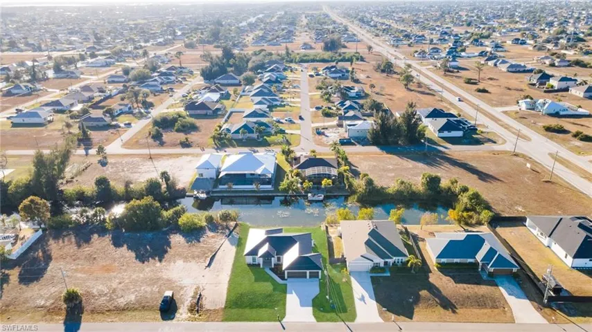 Aerial overview of property's location with nearby suburban area