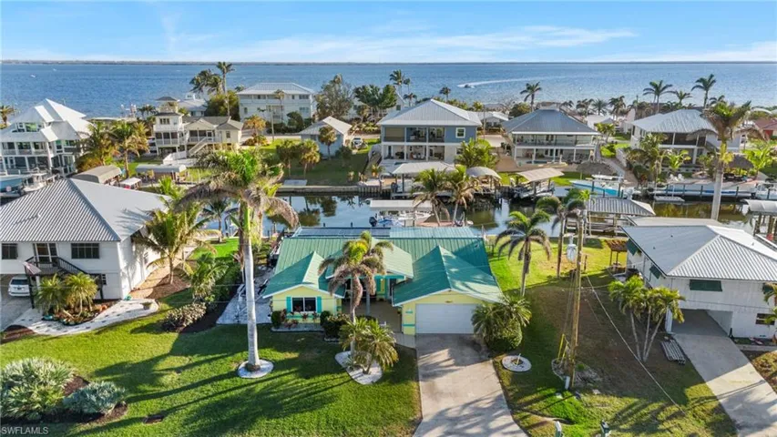 Drone / aerial view featuring a water view, Sanibel Island in background!