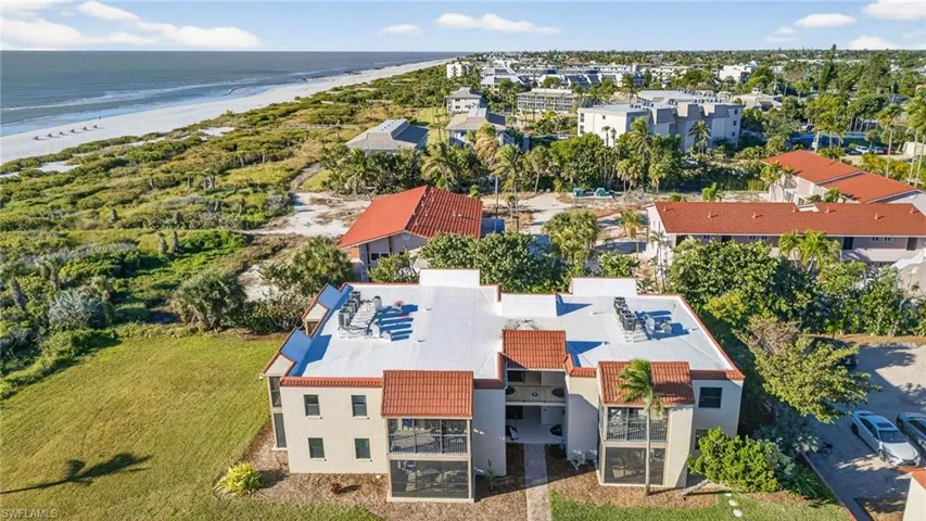 Drone / aerial view of waterfront with a beach