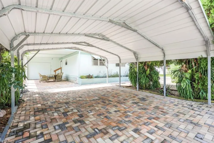 View of patio / terrace with a carport