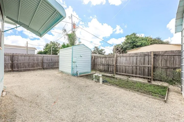 View of yard with a shed
