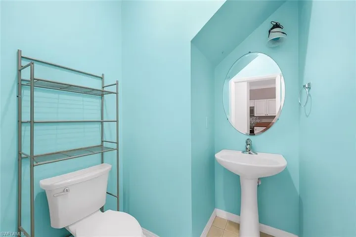 Bathroom featuring toilet and tile patterned flooring