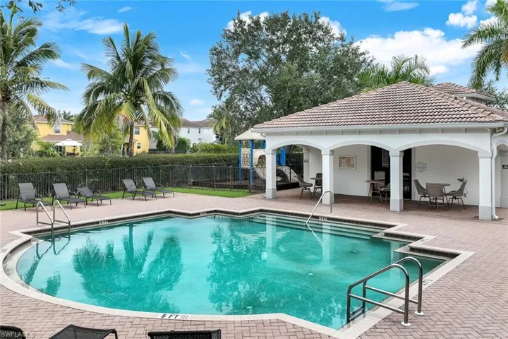 Community pool with a patio area