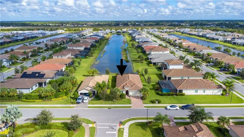 Aerial view of residential area with a nearby body of water