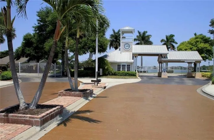 View of home's community with fence