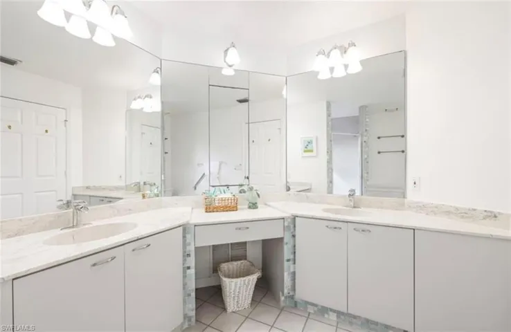 Bathroom featuring vanity and tile patterned floors