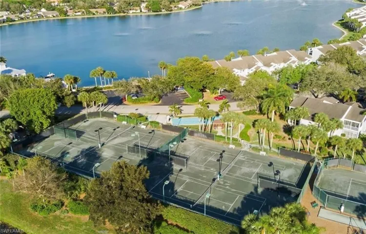 Aerial view featuring a residential view and a water view