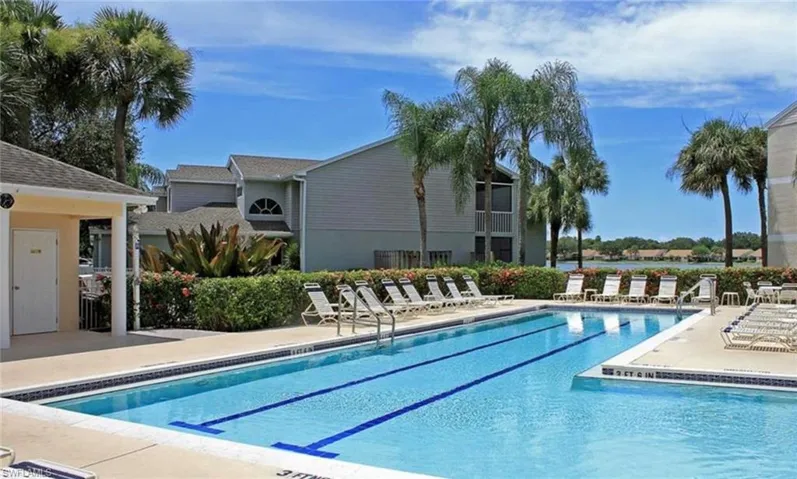 Community pool with a patio
