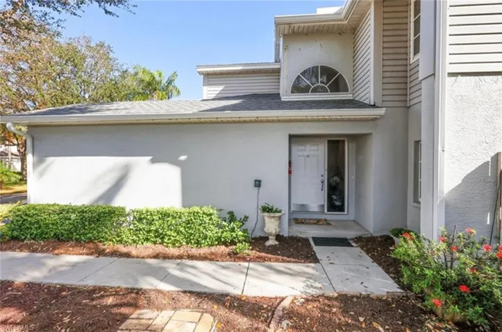 View of exterior entry featuring stucco siding