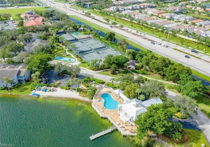 Drone / aerial view featuring a residential view and a water view