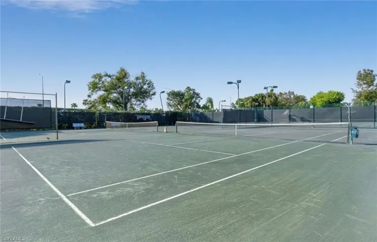 View of sport court featuring fence