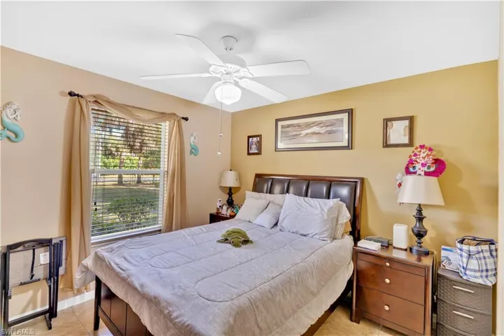 Bedroom featuring ceiling fan and light tile patterned floors