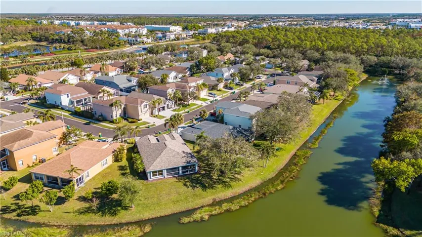Aerial view of residential area featuring a large body of water