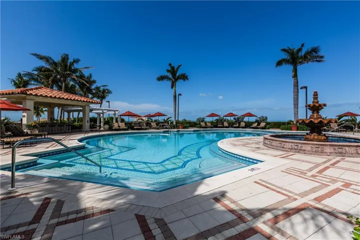 Community pool featuring a patio area and a gazebo