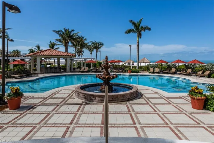 Community pool with a gazebo and a patio