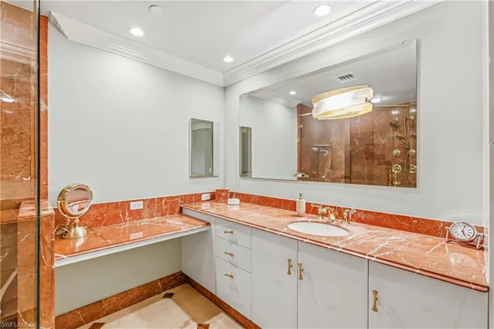 2nd Bathroom with a walk in shower, ornamental molding, vanity, light tile patterned floors, and recessed lighting