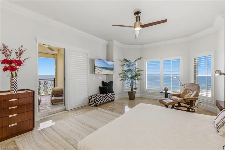Primary Bedroom featuring crown molding and ceiling fan