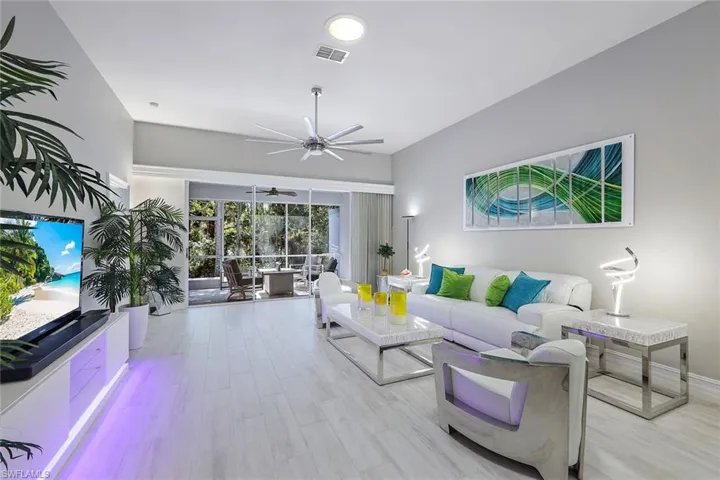 Beautiful open floor plan with wood plank tile floors and neutral colors throughout!