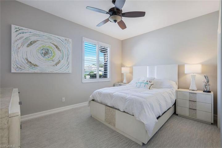 Guest bedroom with natural light flowing through the plantation shutter