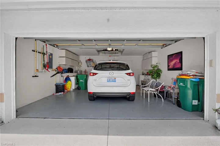 Garage has built in shelving, attic pulldown storage