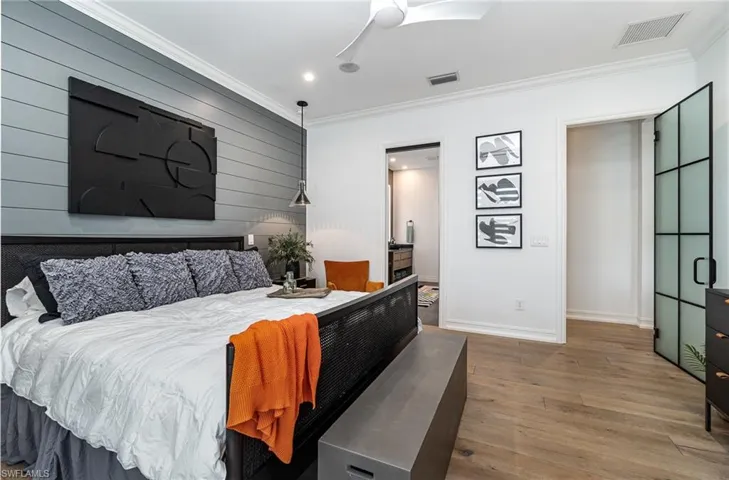 Bedroom featuring crown molding, ceiling fan, and hardwood / wood-style flooring